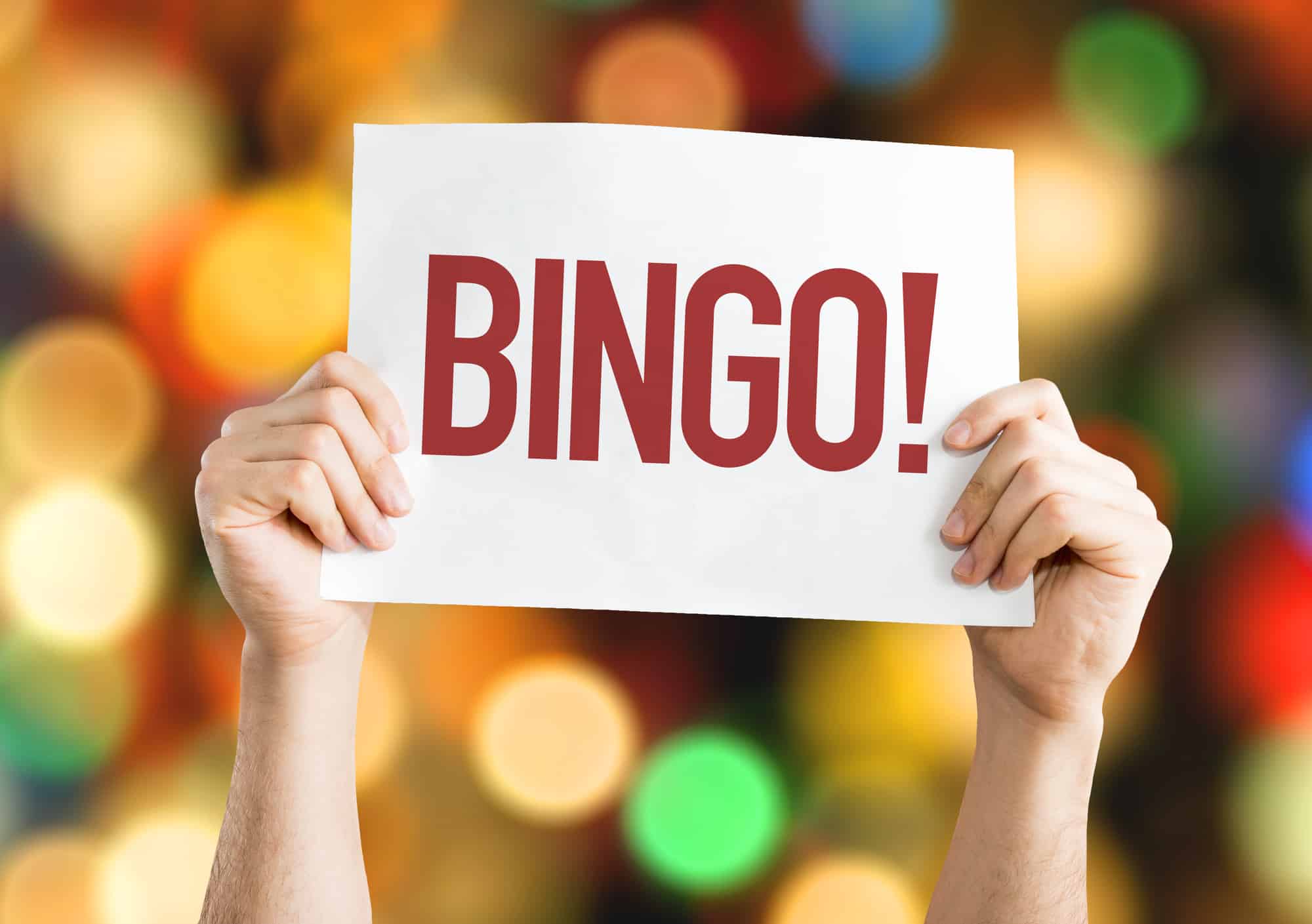 The word BINGO being held up on a card